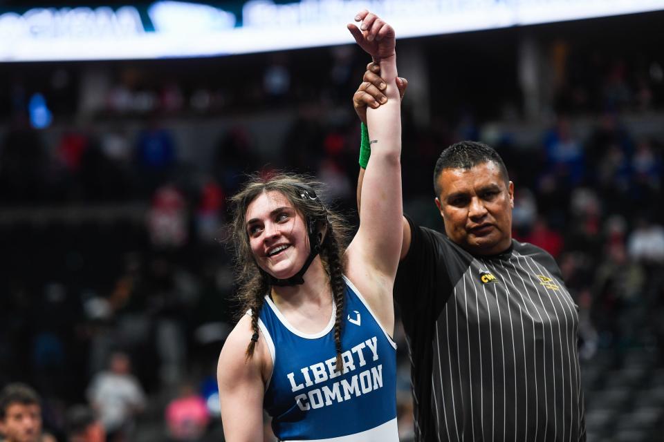 Liberty Common's Viviana Torrejon raises a hand after defeating Gunnision's Ava Witzel 3-2 at the Colorado state high school wrestling tournament at Ball Arena on Thursday, Feb. 16, 2023 in Denver, Colo.