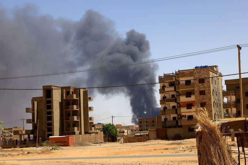 FILE PHOTO: Smoke rises above buildings after an aerial bombardment in Khartoum North