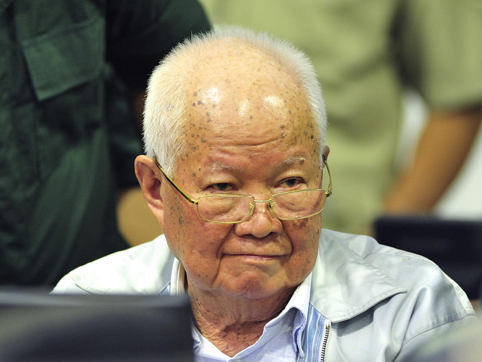 In this photo released by the Extraordinary Chambers in the Courts of Cambodia, Khieu Samphan, former Khmer Rouge head of state, sits in a court room before a hearing at the U.N.-backed war crimes tribunal in Phnom Penh, Cambodia, Friday, Nov. 16, 2018. The international tribunal to judge the criminal responsibility of former Khmer Rouge leaders for the deaths of an estimated 1.7 million Cambodians opened its session Friday to deliver its verdicts on charges of genocide and other crimes. (Mark Peters/Extraordinary Chambers in the Courts of Cambodia via AP)