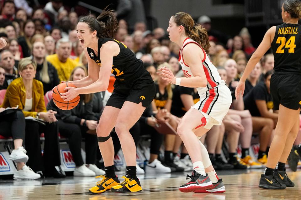Iowa guard Caitlin Clark draws a foul from Ohio State's Taylor Mikesell during the Hawkeyes' 83-72 win at Value City Arena on Jan. 23.