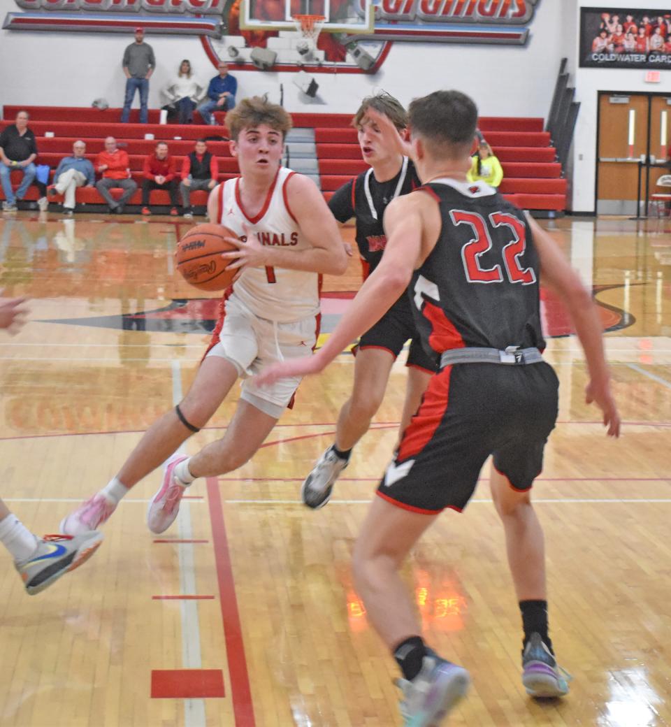 Coldwater's Ayden Dirschell drives to the bucket from two points Friday versus Marshall