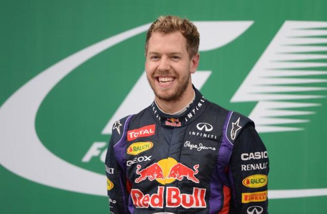 Red Bull driver Sebastian Vettel of Germany celebrates on his car