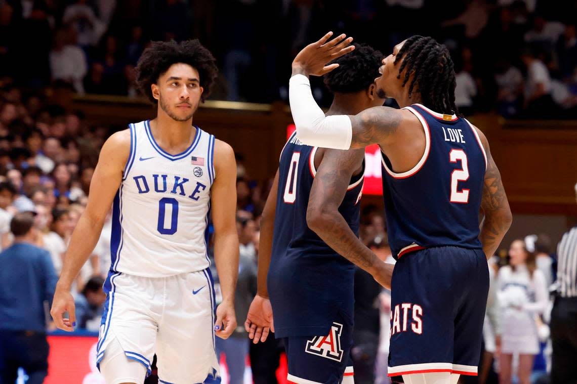 Arizona’s Caleb Love (2) waves to the Cameron Crazies as Duke’s Jared McCain (0) walks off the court after Arizona’s 78-73 victory over Duke at Cameron Indoor Stadium in Durham, N.C., Friday, Nov. 10, 2023.