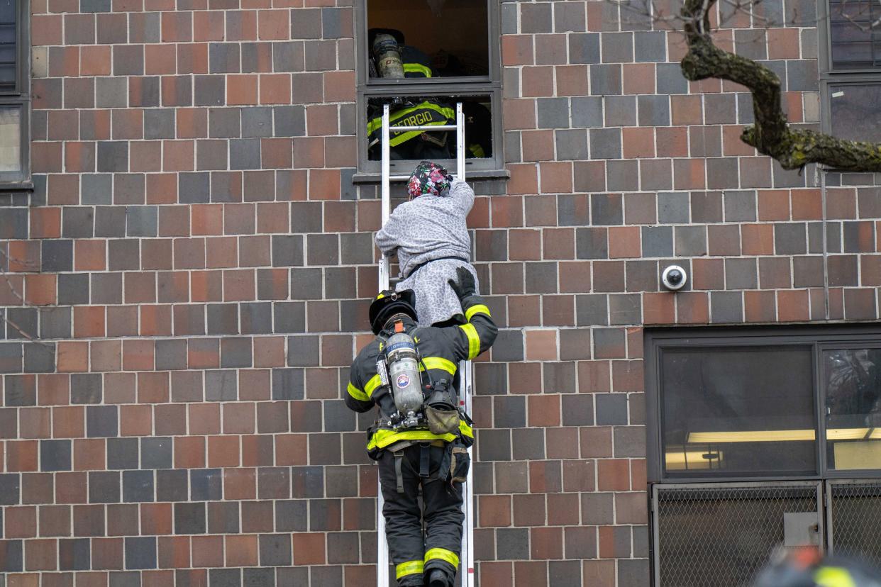 Thirty people, including several children, were critically injured, with firefighters making dramatic rescues using tower ladders and ladders, after a fire broke out inside a third-floor duplex apartment at 333 East 181st St. in the Bronx on Sunday, Jan. 9, 2022.