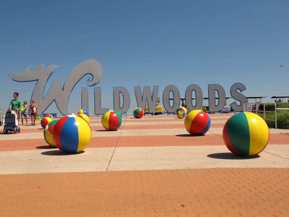 In this July 2, 2012 photo visitors walk on the Wildwood, N.J. boardwalk. A measure being pushed by some New Jersey lawmakers would allow boardwalks to use money reserved for road repairs. It was inspired by the poor condition of the Wildwood boardwalk's support structure, which is badly in need of repairs. (AP Photo/Wayne Parry)