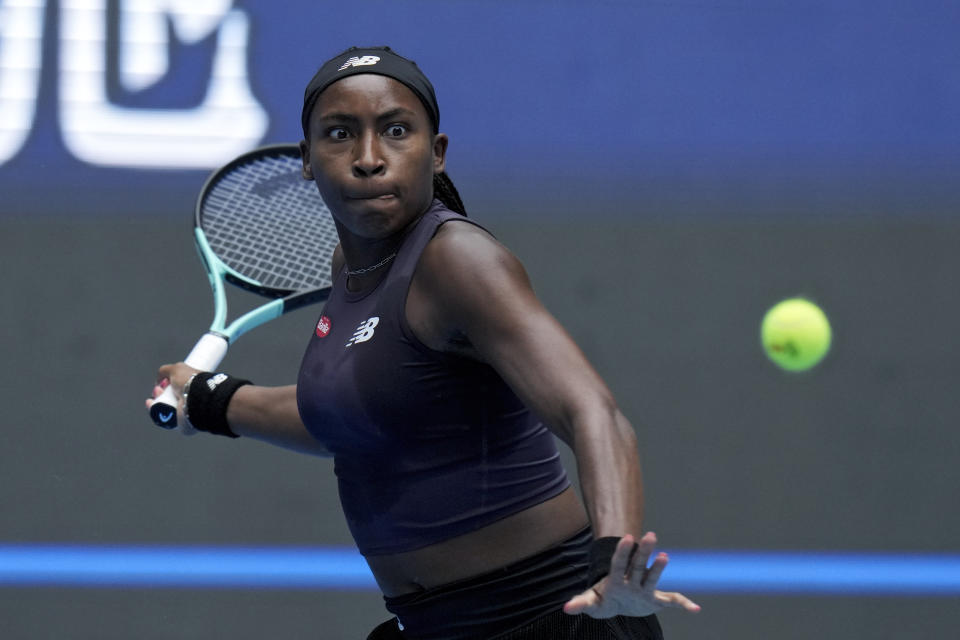 Coco Gauff of the United States eyes on the ball as she plays against Maria Sakkari of Greece during the women's singles quarterfinal match in the China Open tennis tournament at the Diamond Court in Beijing, Friday, Oct. 6, 2023. (AP Photo/Andy Wong)