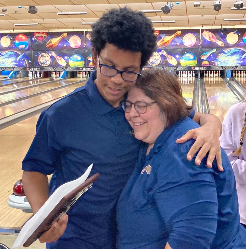 Hackensack sophomore John James shares a hug with coach Nancy Wallace after winning the championship at the Feb. 7 Bergen County boys bowling individual tournament at Bowler City.