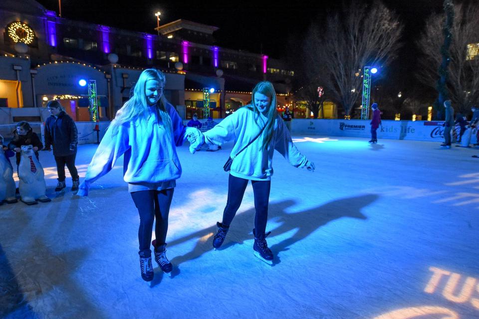 Dec 15, 2022; Tuscaloosa, Alabama, USA;  Skaters enjoy the ice rink which is part of the Holidays on the Plaza at Government Plaza in Tuscaloosa.