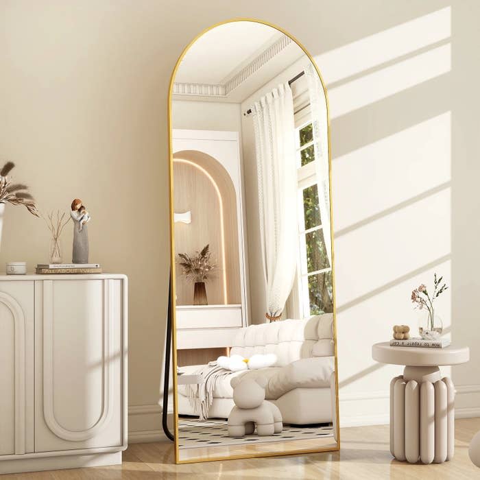 freestanding mirror in room