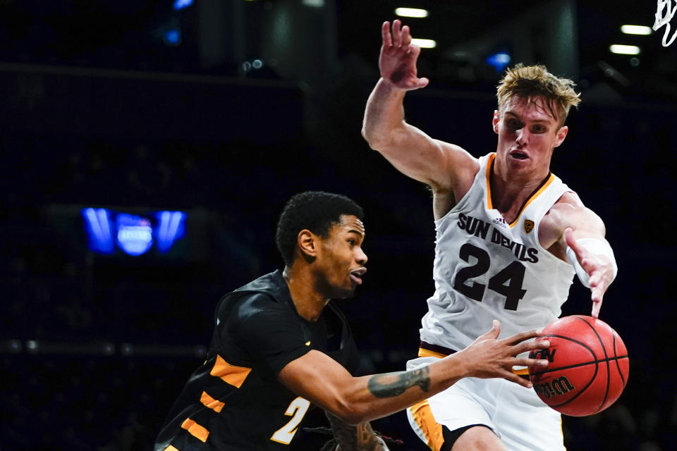 Arizona State's Duke Brennan (24) defends Virginia Commonwealth's Zeb Jackson (2) during the second half of an NCAA college basketball game at the Legends Classic Wednesday, Nov. 16, 2022, in New York. Arizona State won 63-59. (AP Photo/Frank Franklin II)