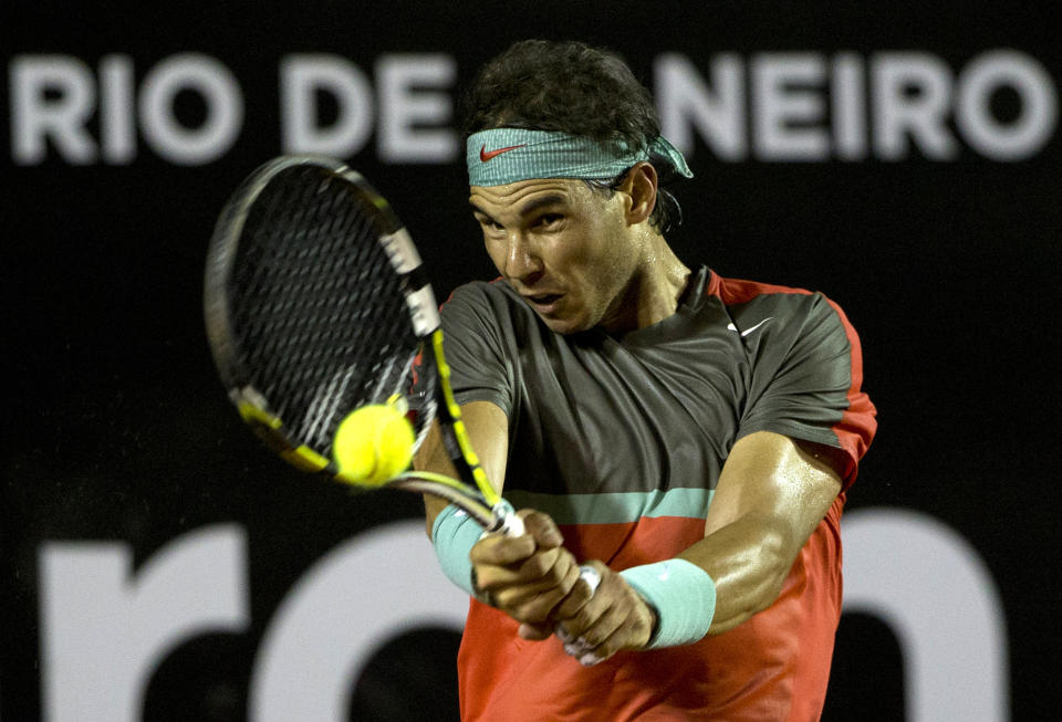 Rafael Nadal, of Spain, returns the ball to Albert Montanes, of Spain, at the Rio Open tennis tournament in Rio de Janeiro, Brazil, Thursday, Feb. 20, 2014. (AP Photo/Silvia Izquierdo)