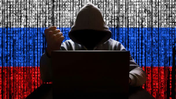 PHOTO: Stock photo illustration of a Russian flag and computer hacker. (STOCK PHOTO/Getty Images)