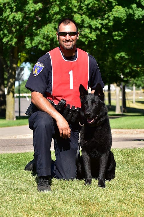 Sgt. Brian Cameron poses for a photo with his partner, Parker.