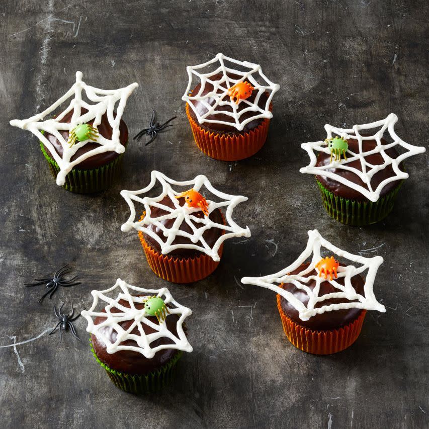 <p>These creepy crawly cupcakes will stand out on the desserts table.</p><p>Get the recipe from <a href="https://www.goodhousekeeping.com/holidays/halloween-ideas/g2711/halloween-cupcakes/?slide=1" rel="nofollow noopener" target="_blank" data-ylk="slk:Good Housekeeping;elm:context_link;itc:0;sec:content-canvas" class="link ">Good Housekeeping</a>.</p>