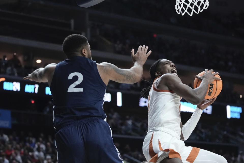 Texas' Marcus Carr drives by Penn State's Myles Dread during the second half of a second-round college basketball game in the NCAA Tournament Saturday, March 18, 2023, in Des Moines, Iowa. (AP Photo/Morry Gash)