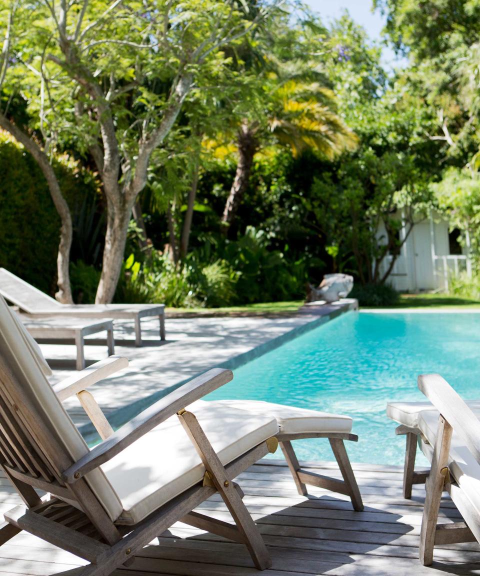 sun loungers near pool