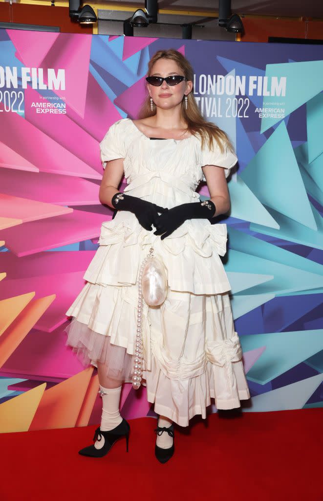 <span class="caption">Haley Bennett in a Simone Rocha look, including beaded socks and opera gloves and an egg-like purse.</span><span class="photo-credit">David M. Benett - Getty Images</span>