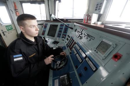 Estonian navy conscript Dimitri Komosko takes part in a training exercise in Tallinn, Estonia February 17, 2017. Picture taken February 17, 2017. REUTERS/Ints Kalnins