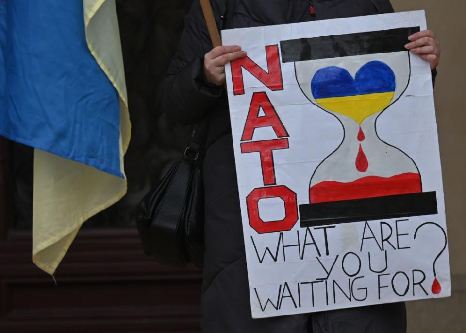 An activist holds a poster saying "NATO What Are You Waiting For?" during a protest against Russia's full-scale war against Ukraine in Krakow, Poland, on Jan. 15, 2023. (Photo by Artur Widak/NurPhoto via Getty Images)