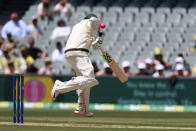 Australia's Usman Khawaja is hit by a delivery from the West Indies during their cricket test match in Adelaide, Thursday, Nov. 8, 2022. (AP Photo/James Elsby)
