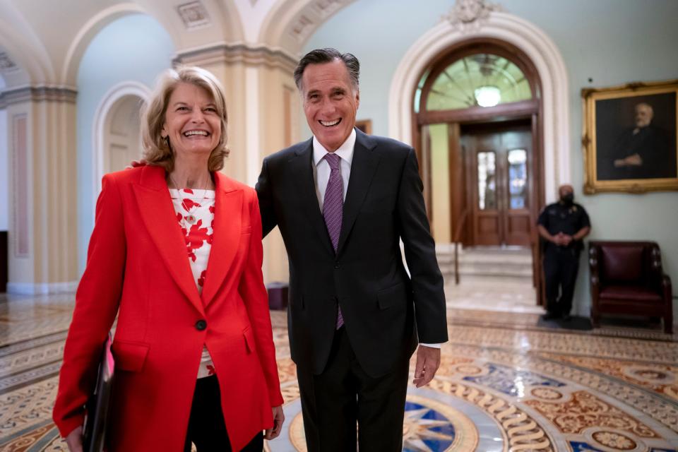 Senator Lisa Murkowski, pictured with  Senator Mitt Romney (Copyright 2022 The Associated Press. All rights reserved)