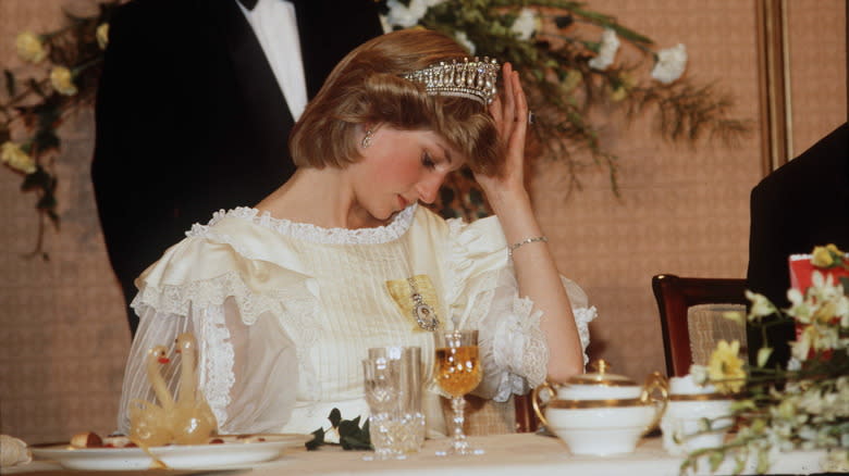 Princess Diana sitting at table