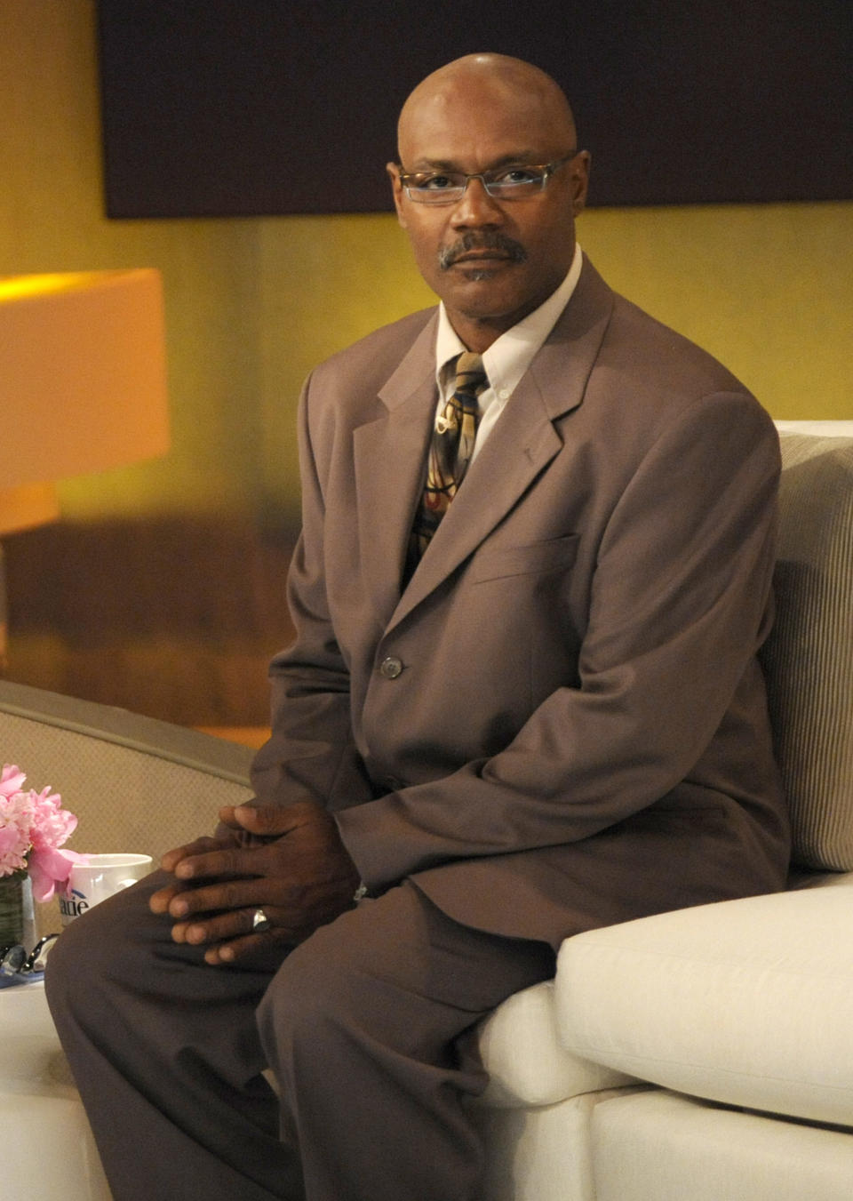 Marvin Anderson sitting on a couch about to do an interview with Katie Couric about his case