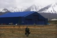 <p>NASA Operation IceBridge mission scientist John Sonntag walks to the hangar after a long science flight aboard NASA’s research aircraft in the Antarctic Peninsula region, on Nov. 3, 2017. (Photo: Mario Tama/Getty Images) </p>