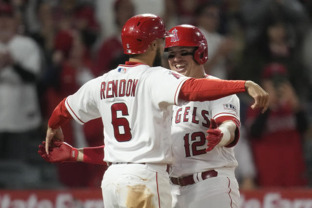 Los Angeles Angels' Hunter Renfroe (12) is greeted by Mike Trout