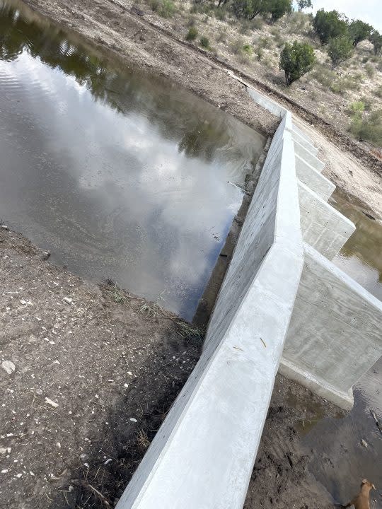 Photos taken last fall. provided to KXAN by landowners in Mason County, show a dam built along Leon Creek.