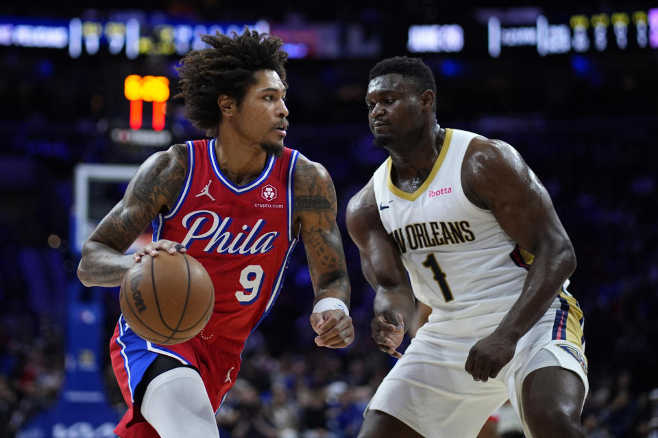 Philadelphia 76ers' Kelly Oubre Jr., left, tries to get past New Orleans Pelicans' Zion Williamson during the first half of an NBA basketball game, Friday, March 8, 2024, in Philadelphia. (AP Photo/Matt Slocum)