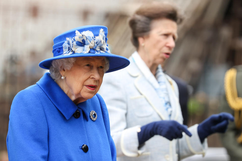 GLASGOW, SCOTLAND - JUNE 30: Queen Elizabeth II and Princess Anne, Princess Royal during a visit to the Children's Wood Project on June 30, 2021 in Glasgow, Scotland. The Children’s Wood Project is a dedicated green space designed to connect local people with nature, raise aspirations and bring the community together through outdoor activities such as gardening, beekeeping and forest schools. The Queen is visiting Scotland for Royal Week between Monday 28th June and Thursday 1st July 2021. (Photo by Chris Jackson/Getty Images)