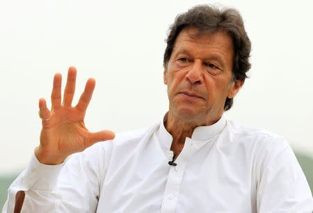 Imran Khan, chairman of the Pakistan Tehreek-e-Insaf (PTI) political party, speaks with a Reuters correspondent during an interview at his home in the hills of Bani Gala on the outskirts of Islamabad, Pakistan July 29, 2017. REUTERS/Caren Firouz