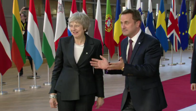 Mrs May was greeted in Brussels by Luxembourg’s Prime Minister Xavier Bettel (European Commission Audiovisual Services/PA)