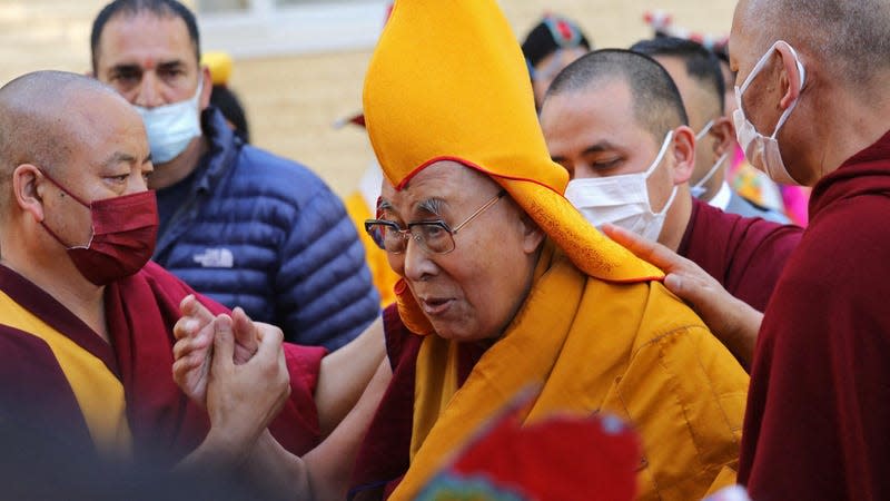 Tibetan spiritual leader Dalai Lama (C) arrives to attend a prayer at the Main Tibetan Temple in McLeod Ganj on April 5, 2023.