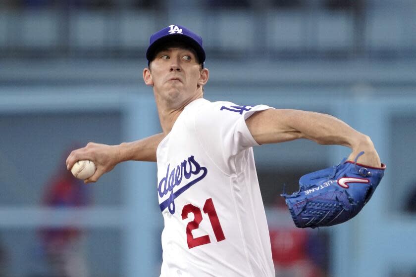 Los Angeles Dodgers starting pitcher Walker Buehler throws to the plate during the first inning.