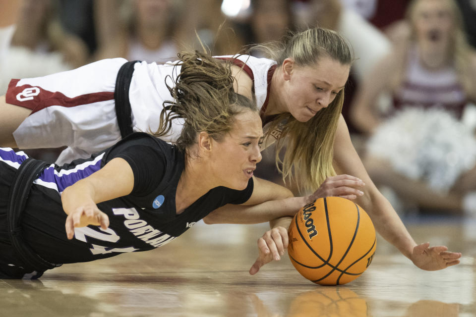 Portland guard Maisie Burnham, left, and Oklahoma guard Aubrey Joens vie for the ball in the first half of a first-round college basketball game in the NCAA Tournament, Saturday, March 18, 2023, in Los Angeles. (AP Photo/Kyusung Gong)