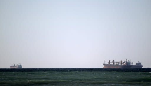 Oil tankers cruise along the Strait of Hormuz off the shores of Tibat in Oman. Iran will close the strategic Strait of Hormuz at the entrance to the oil-rich Gulf only if its crude revenues are seriously threatened, its top military commander said in remarks reported on Saturday