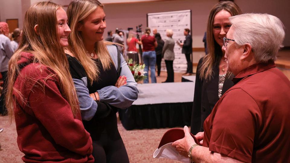 WT women's soccer players Mandy Sticker and Alli Holder and Kimberly Dudley, assistant athletic director for leadership, from left, thank donor Judy Fugate, right, after the announcement of a $1.8 million legacy gift to WT women's athletics.