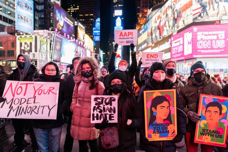 Hundreds gathered in New York City’s Times Square for a vigil recognising Michelle Go, who was pushed to her death from a subway platform on 15 January. (REUTERS)