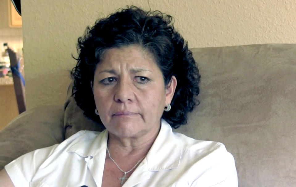 FILE- In this July 14, 2015, file image from video, Tina Cordova talks of her late father, Anastacio Cordova, in her Albuquerque, N.M., home. Cordova believes her father, who died in 2013 after suffering from multiple bouts of cancer, was affected by the atomic bomb Trinity Test in New Mexico since he lived in nearby Tularosa, N.M. as a child. The Western Governors' Association said Friday, Oct. 11, 2019, atmospheric nuclear weapons testing exposed more states and more people to radiation fallout and resulting cancers and other diseases than the federal government recognizes. (AP Photo/Russell Contreras, File)