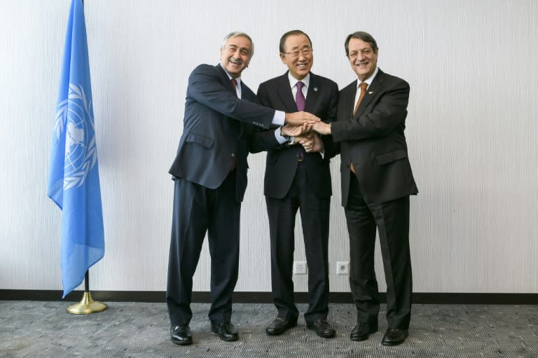 United Nations Secretary-General Ban Ki-Moon (C) poses with Turkish Cypriot leader Mustafa Akinci (L) and Greek Cypriot President Nicos Anastasiades on November 7, 2016