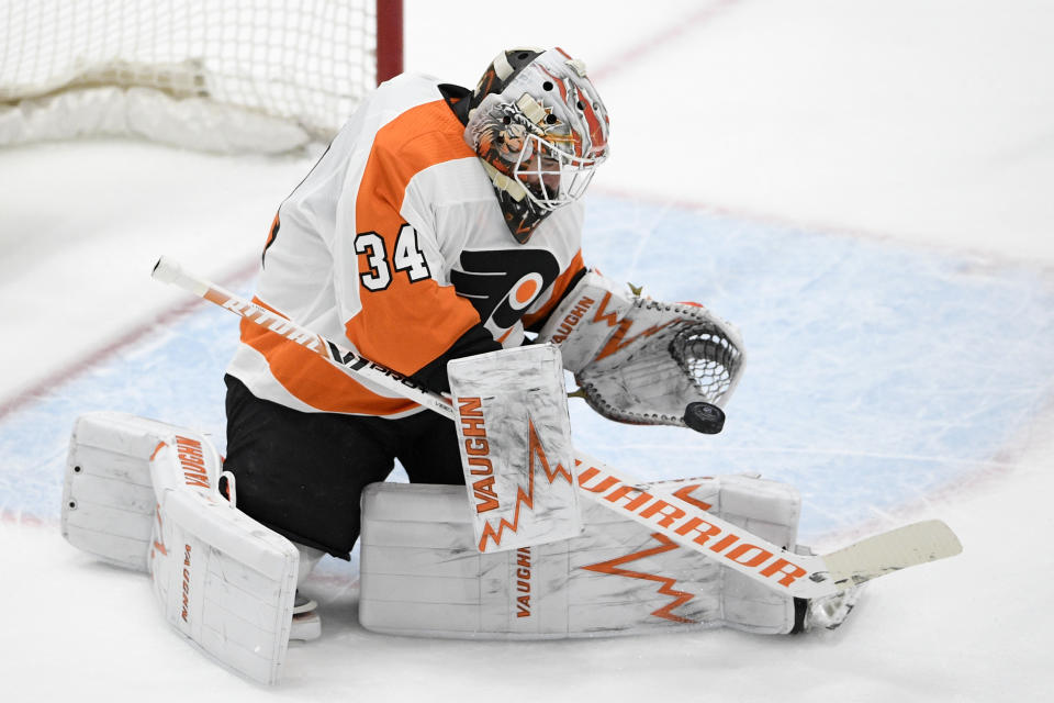 Philadelphia Flyers goaltender Alex Lyon stops the puck during the first period of the team's NHL hockey game against the Washington Capitals, Saturday, May 8, 2021, in Washington. (AP Photo/Nick Wass)