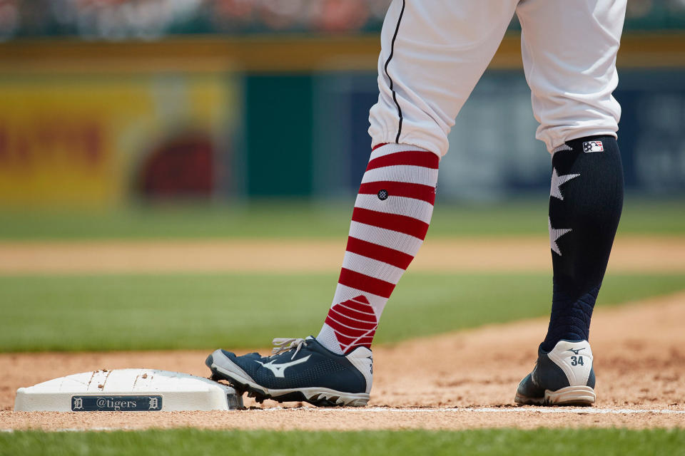 <p>Detroit Tigers catcher James McCann (34) stands on first base wearing sock for Independence Day weekend during the second inning against the Cleveland Indians in the first baseball game of a doubleheader in Detroit, Saturday, July 1, 2017. (Photo: Rick Osentoski/AP) </p>