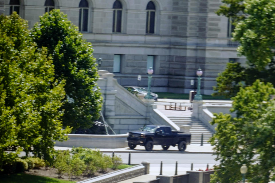 A pickup truck is parked on the sidewalk in front of the Library of Congress’s Thomas Jefferson Building on Thursday. 