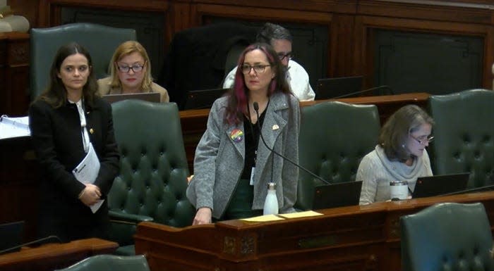 State Rep. Kelly Cassidy, D-Chicago, center, speaks Friday on the House floor in favor of a broad bill that requires insurance coverage of abortion and gender-affirming care medications, along with elements aimed at growing Illinois' reproductive health care work force.