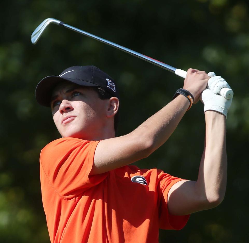 Kyle Smith earned medalist honors and led the Green boys golf team to the team title at Monday's Green Invitational.