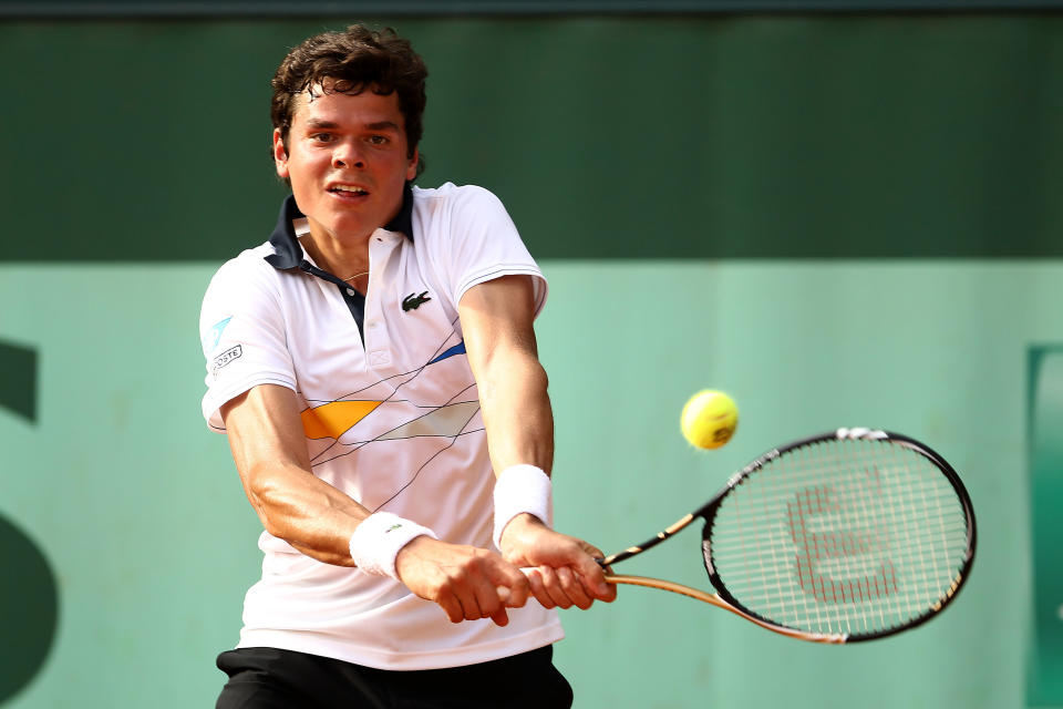 PARIS, FRANCE - JUNE 02: Milos Raonic of Canada plays a backhand during his men's singles third round match against Juan Monaco of Argentina during day seven of the French Open at Roland Garros on June 2, 2012 in Paris, France. (Photo by Matthew Stockman/Getty Images)