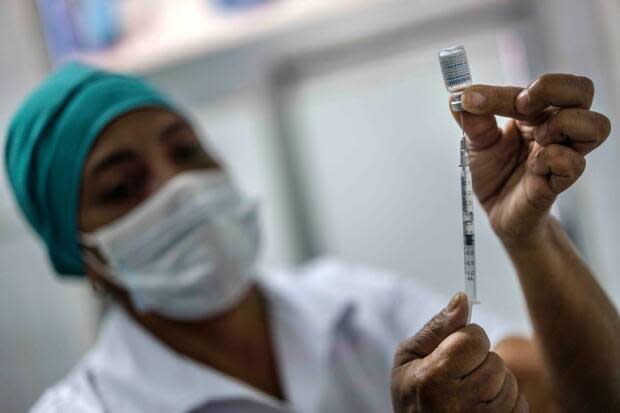 A nurse prepares to inject a health-care worker with a dose of the Soberana-02 COVID-19 vaccine in Havana, Cuba, in March. 