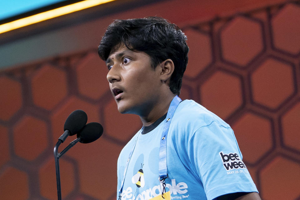 Aryan Khedkar, 13, of Rochester Hills, Mich., reacts to correctly spelling his word during the quarterfinal round of competition in the Scripps National Spelling Bee, in Oxon Hill, Md., Wednesday, May 29, 2024. (AP Photo/Nathan Howard)